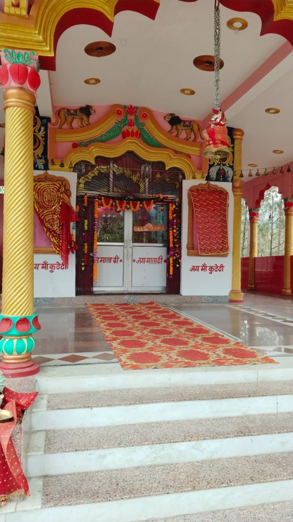 Kuteti Devi Temple in Uttarkashi,    Nestled amid vibrant green forests and rolling hills, the temple exudes a serene, almost mystical atmosphere, framed by the natural beauty of the landscape.